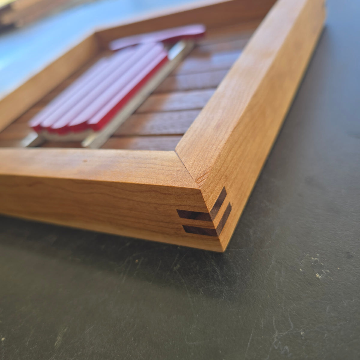 Upclose shot of the walnut splines in a cherry frame