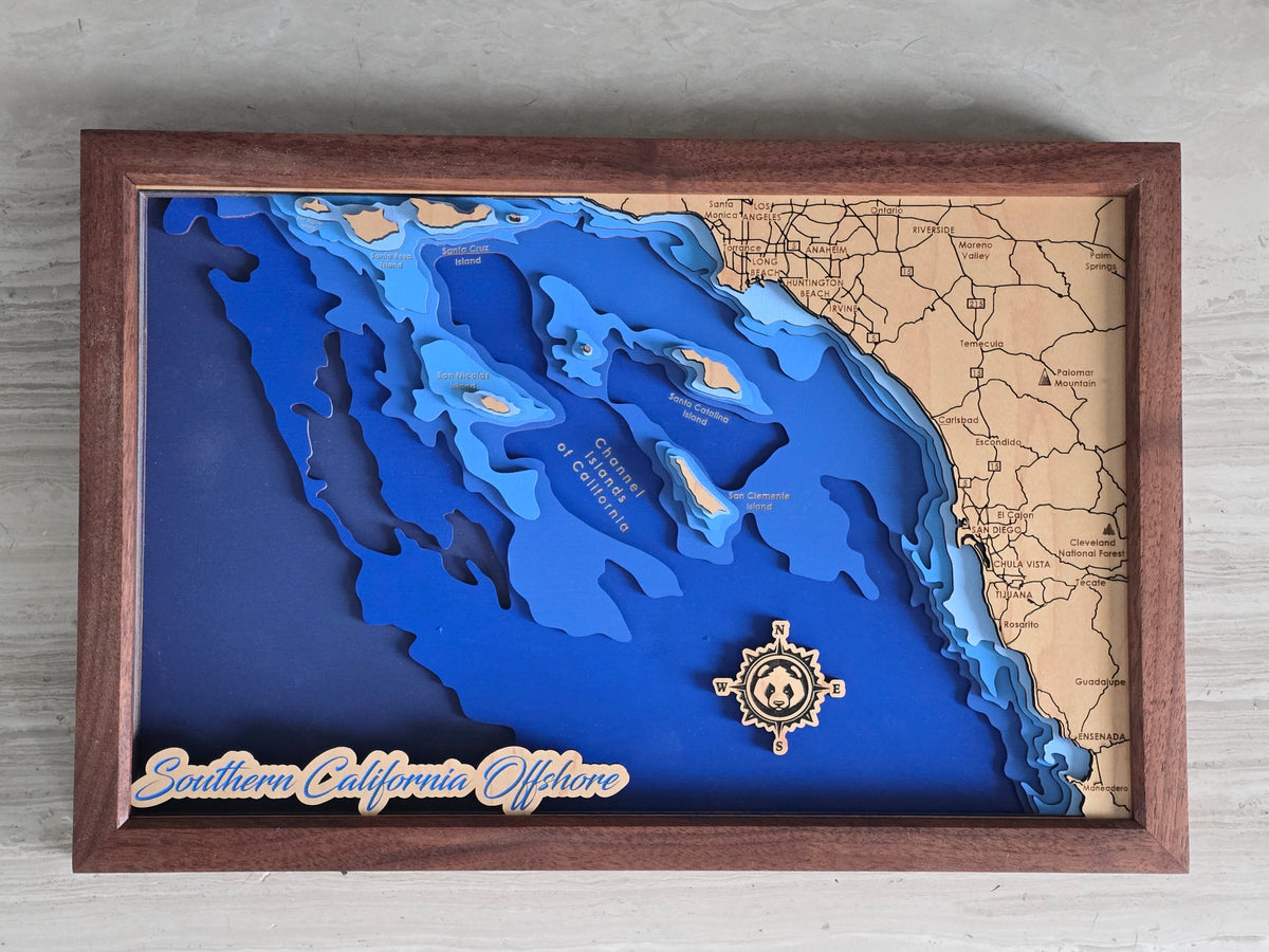 3D bathymetric map of a coastal southern California offshore with a wooden frame and decorative elements.