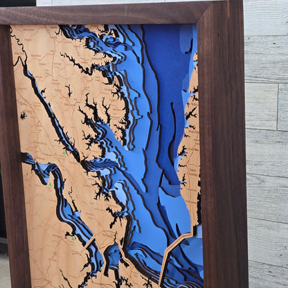 Wooden map with bathymetric details of a coastal area Hampton Roads Virginia, framed in brown.