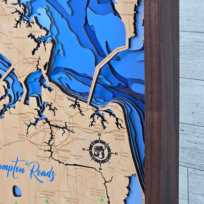 Wooden map with bathymetric details of a coastal area Hampton Roads Virginia, up close of engraved mermaid in the compass rose