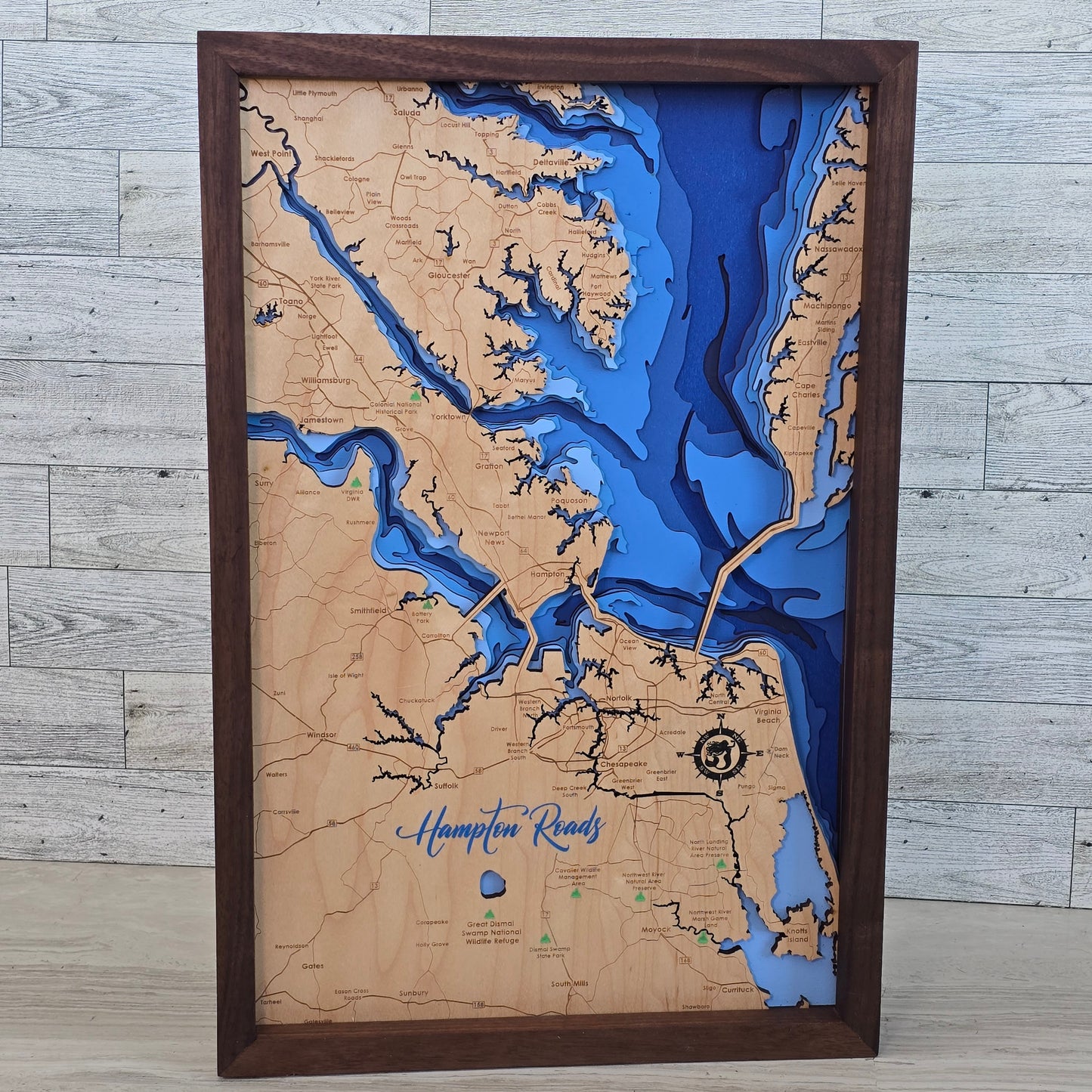 Wooden map with bathymetric details of a coastal area Hampton Roads Virginia , framed in brown.