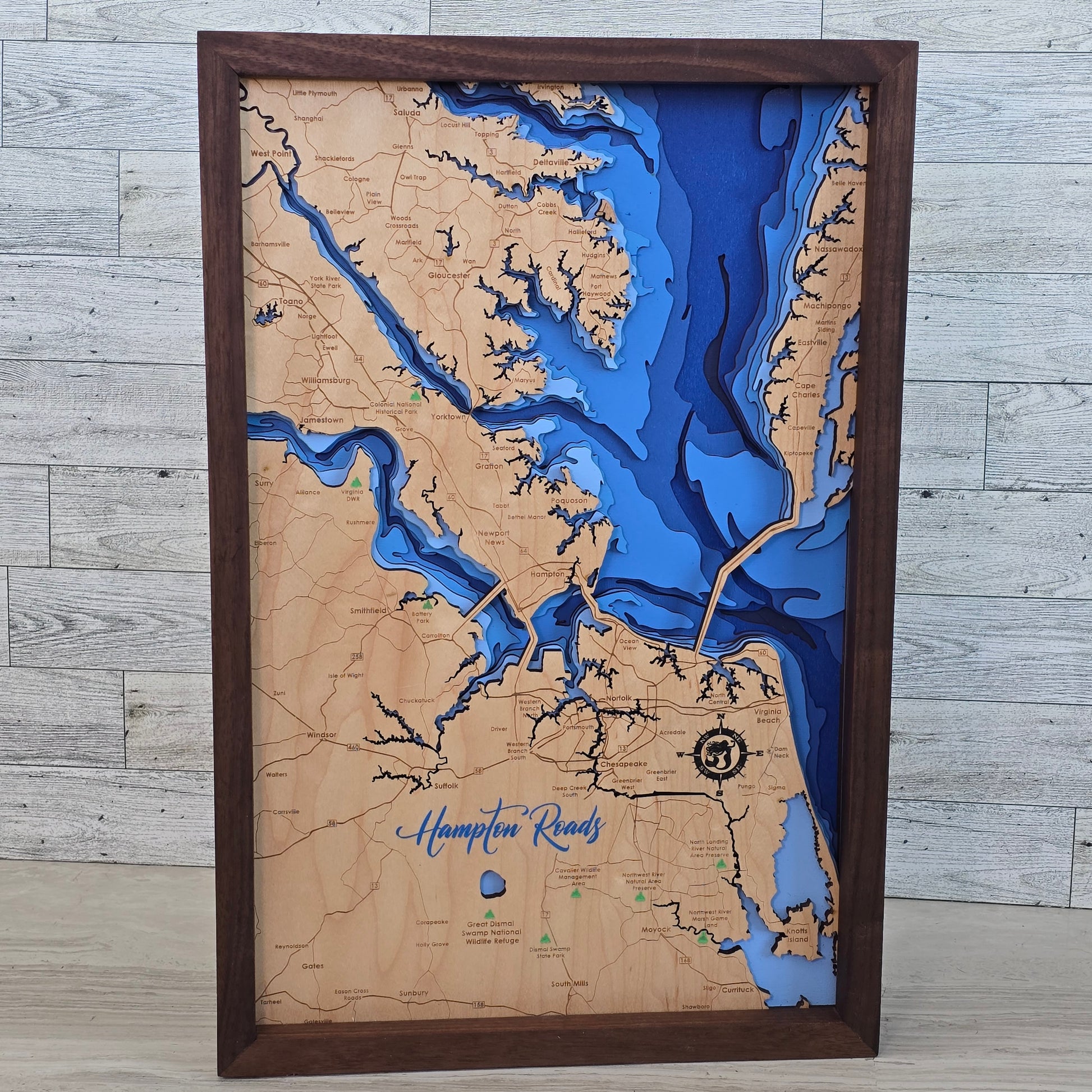 Wooden map with bathymetric details of a coastal area Hampton Roads Virginia , framed in brown.