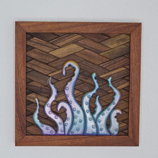 3D iridescent octopus tentacle wall art with a shimmering purple and blue finish on a dark woven wood background with a mahogany-toned frame.