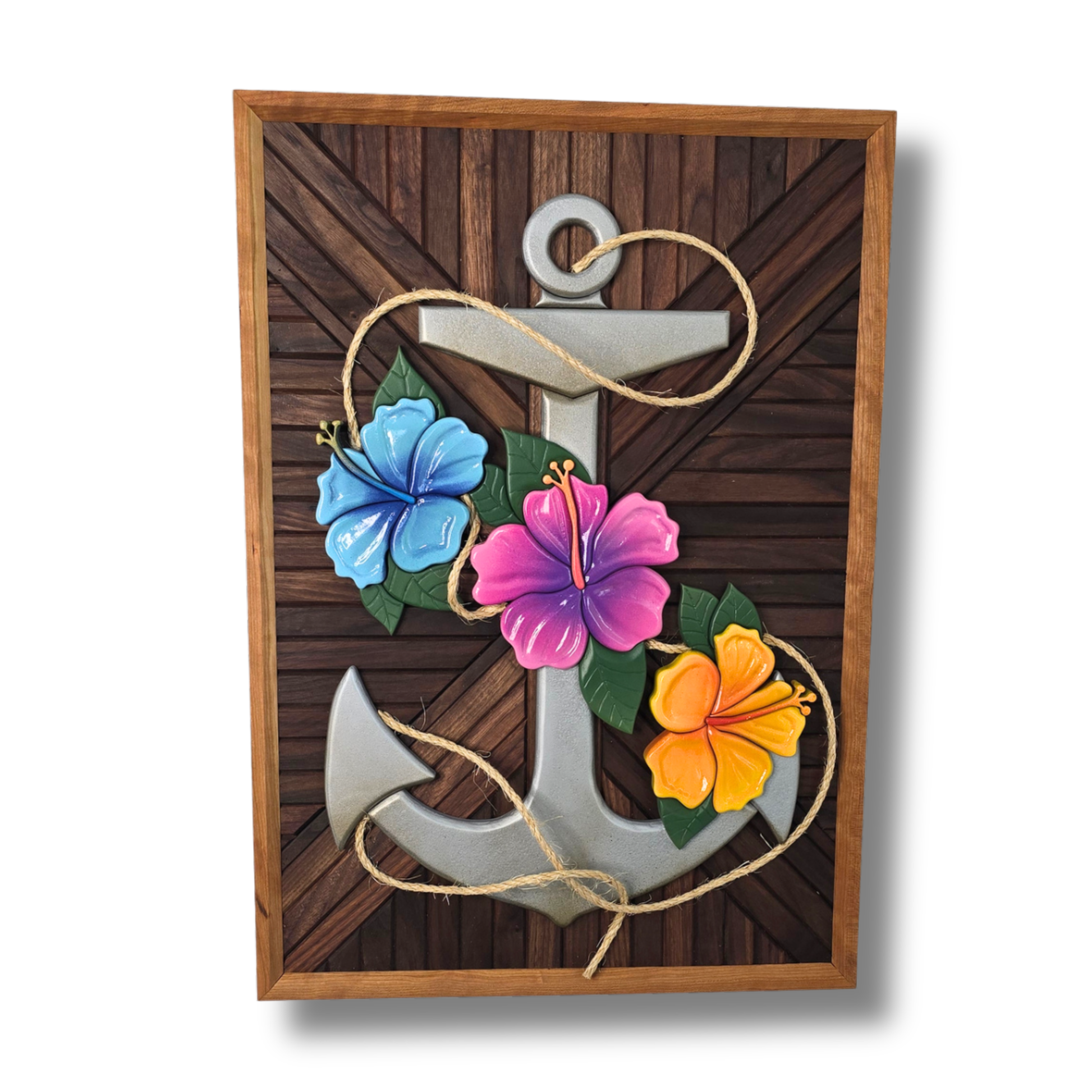 3D silver anchor wall art with blue, pink, and yellow hibiscus flowers and a natural rope accent on a dark chevron wood background.