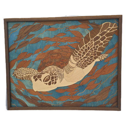 Wooden wall art with a turtle design in a natural setting