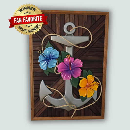 3D silver anchor wall art with blue, pink, and yellow hibiscus flowers and a natural rope accent on a dark chevron wood background. With a winner badge stating the piece is the Fan Favorite