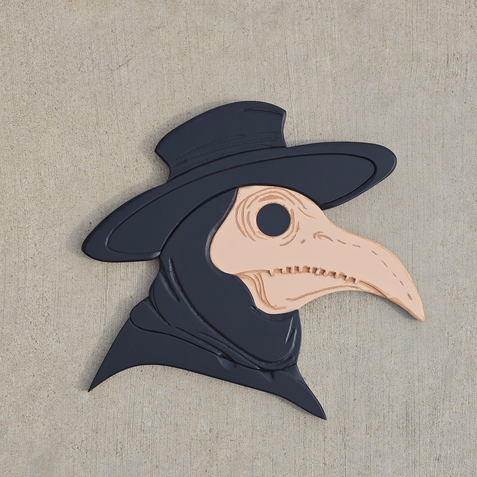 Decorative wall art shaped like a plaque doctor on concreate surface