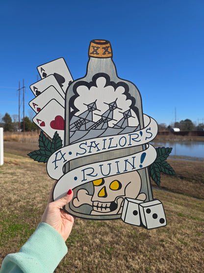 Folk art wood carving, hand-painted with a nautical "Sailor's Ruin" theme. Traditional tattoo motifs including sinking ships, gambling dice, and aces on a layered wooden silhouette.