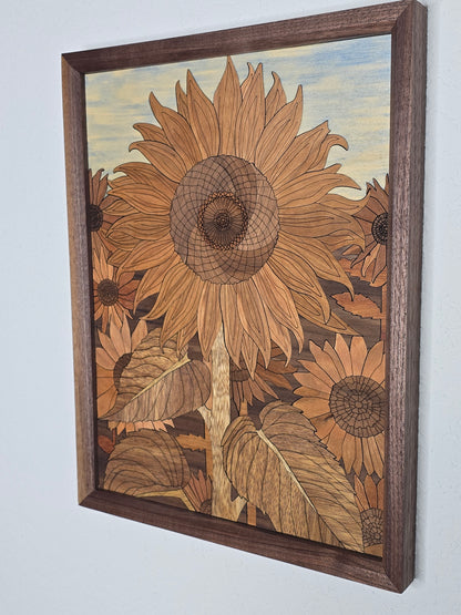 Wooden inlaid artwork of sunflowers in a brown frame on a white background