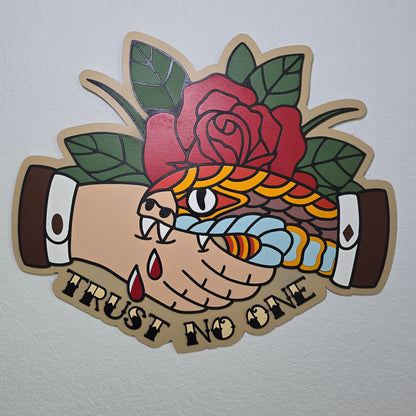Snake biting a hand in a handshake with a rose in the background, and text of "Trust No One" beneath the handshake. In traditional tattoo style