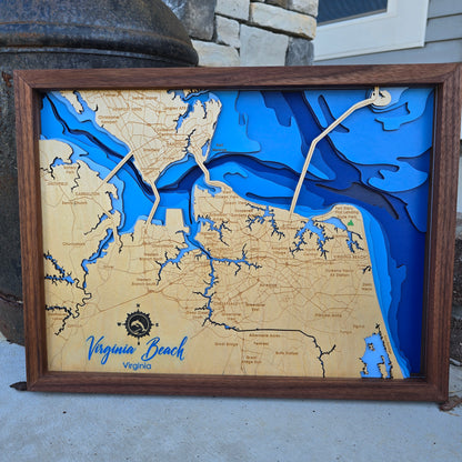 Wooden bathymetric map of Virginia Beach with blue water features, framed in walnut